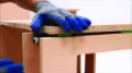 Gloved hand assembling cabinet_jpg.png